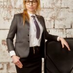 Joan, a happy client from Charlotte, NC, USA, standing confidently after securing a loan from Funder Stone Finance Limited.